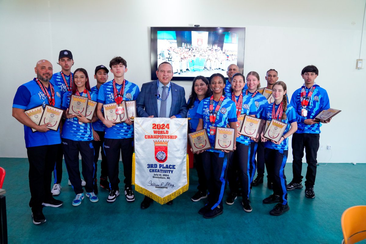 celebrates winning 50 medals