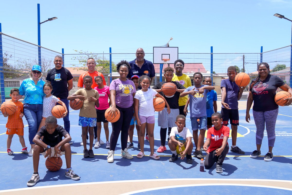 Ricardo Cooper leads a basketball