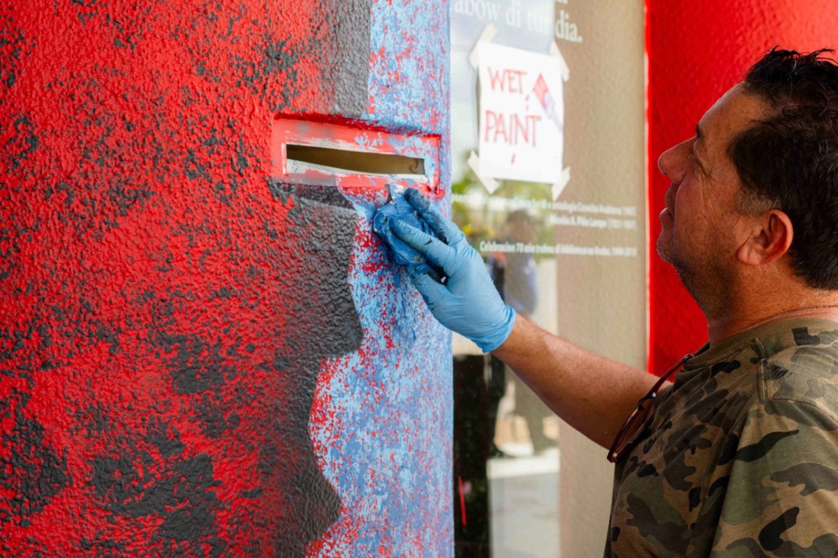 Vibrant mural by Robby Solognier on the Playa Library building