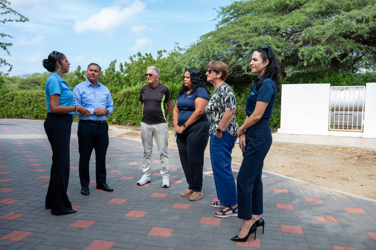 Government officials discussing funding for senior housing projects