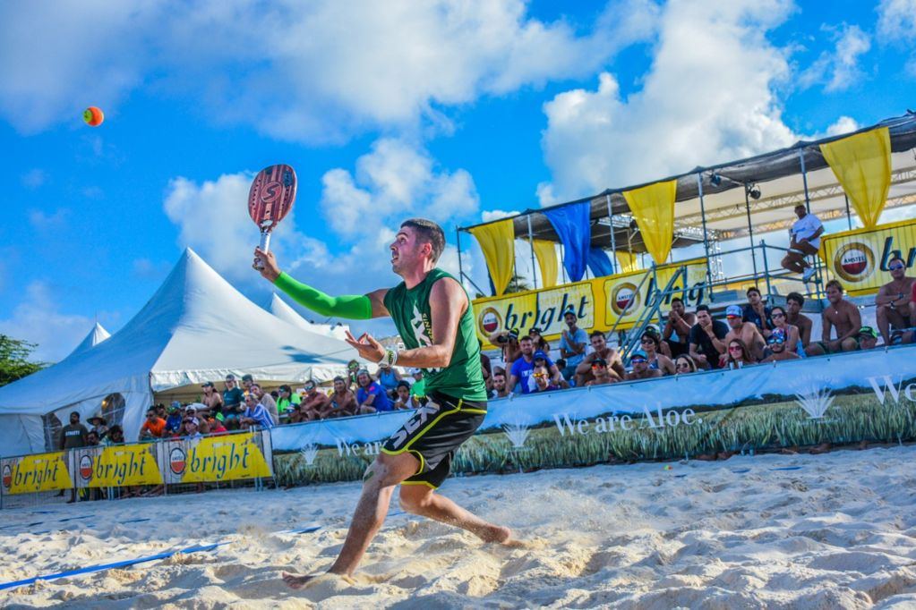 Players competing in a beach tennis match at Aruba