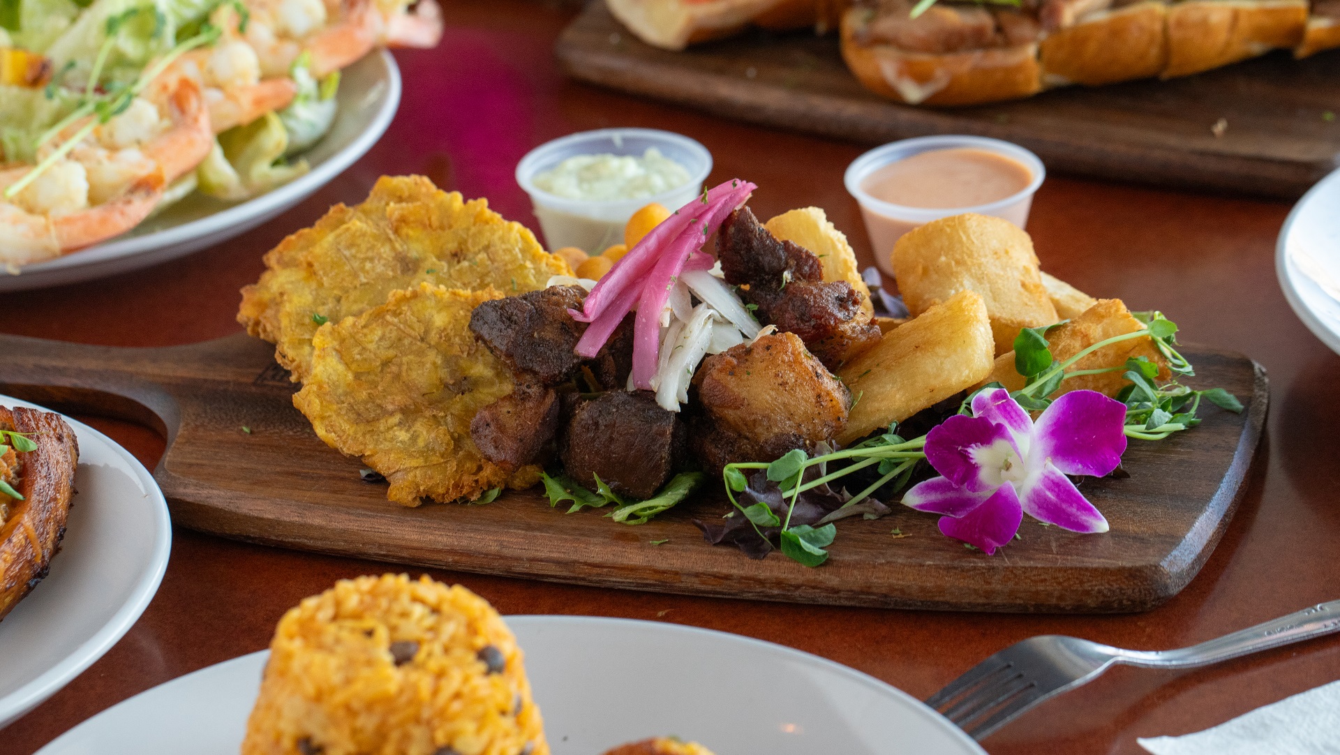 Plates lined up with food and cutlery for a buffet service