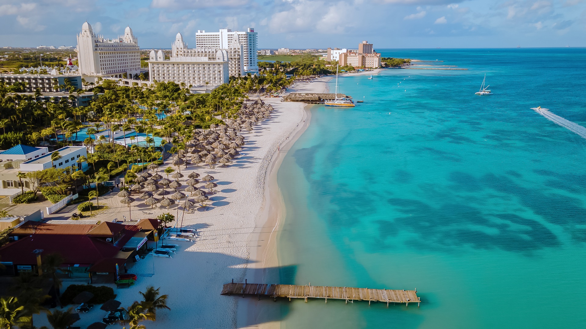 Palm Beach in Aruba with white sand and turquoise waters.