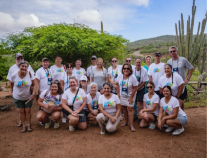 Stunning view of Eagle Beach Aruba with the sun setting over the turquoise water.