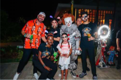 Guests enjoying a Halloween party with costumes and themed decorations at Radisson Blu Aruba.