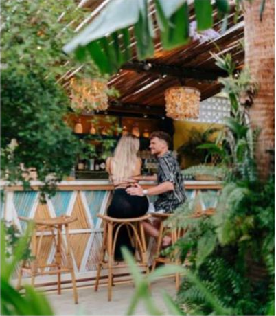 Private dining setup at Boardwalk Boutique Hotel’s tropical garden