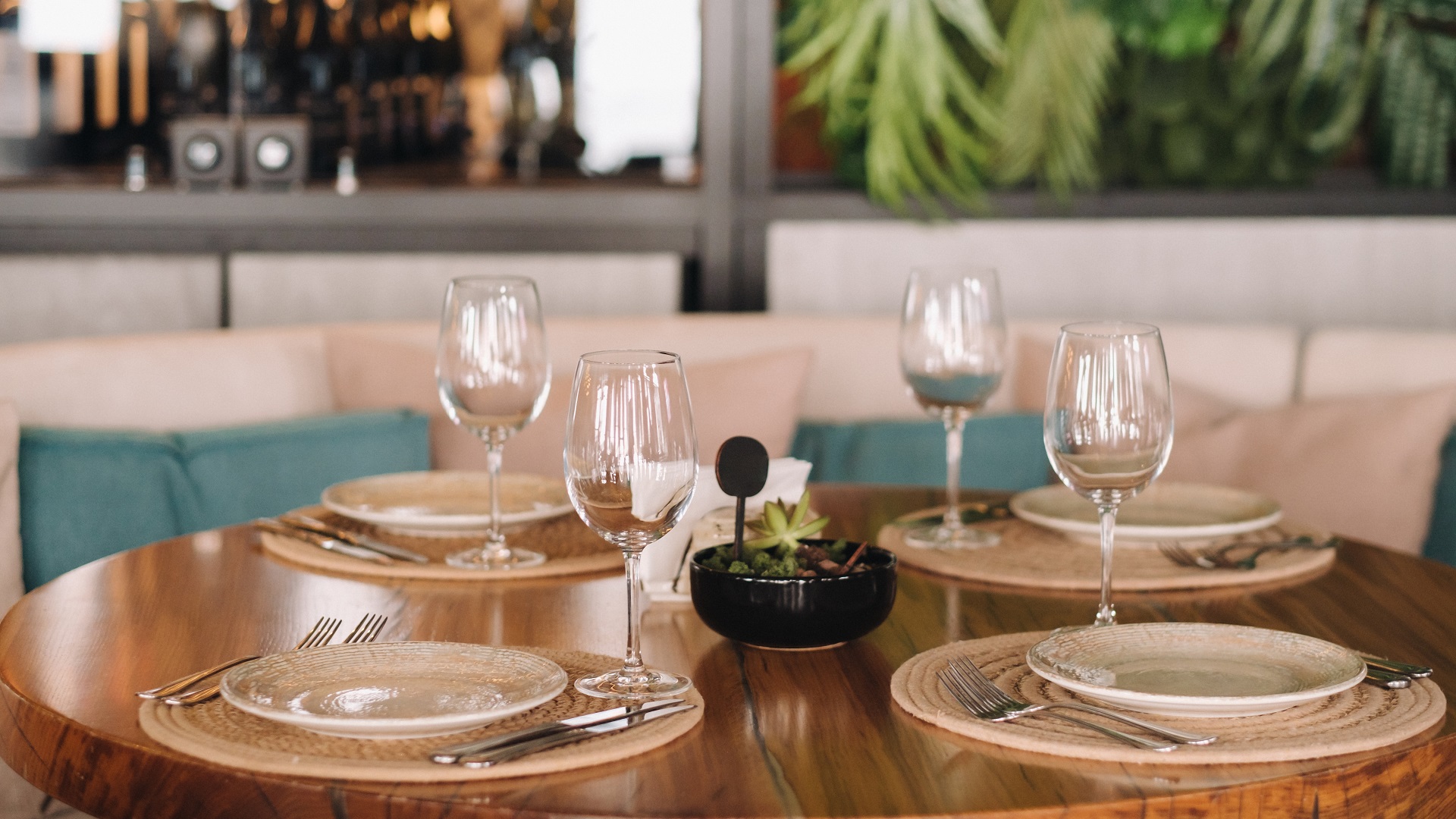 Empty dishes and cutlery set on a table in a restaurant