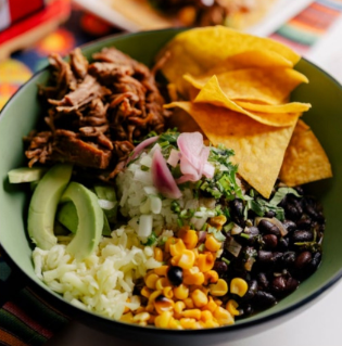 Festive Mexican Night setup at Manchebo Beach Resort with tacos, margaritas, and live mariachi