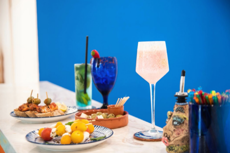 Guests enjoying a mixology workshop with an expert bartender at TRYP by Wyndham Gastro Bar.