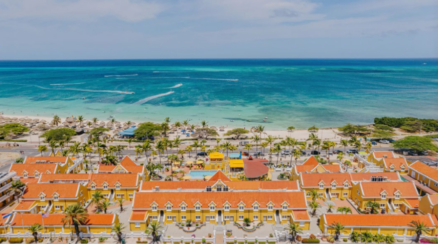 A couple enjoying a beachside breakfast at Amsterdam Manor Beach Resort.