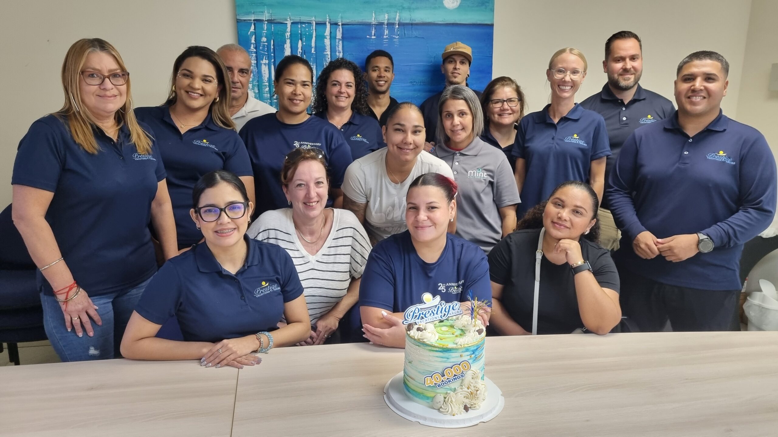 Prestige Vacations Aruba team celebrating 40,000 bookings.