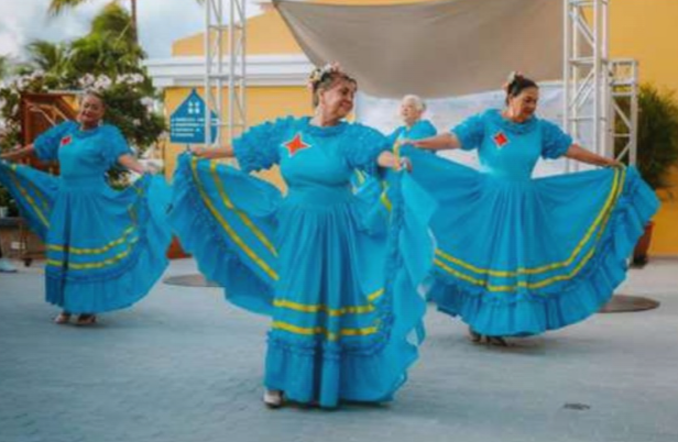 Folkloric dancers performing traditional Aruban dance in colorful costumes