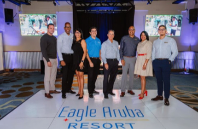 Guests attending corporate gathering in Eagle Aruba’s ballroom