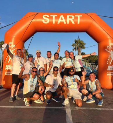 Boardwalk Boutique Hotel team celebrating after 5K finish in Aruba