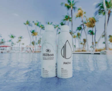 Sustainable PATH water bottle placed in Hilton Aruba hotel room