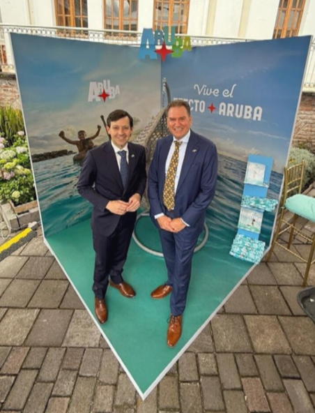 Aruba tourism booth at Europe Day celebration in Quito with promotional materials