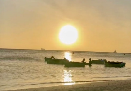 Guests enjoy poetry and music under twinkling lights at Boardwalk Aruba garden event