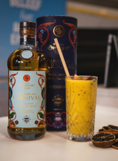 Guests enjoying tropical drinks made with Papiamento Rum at Aruba’s activation booth