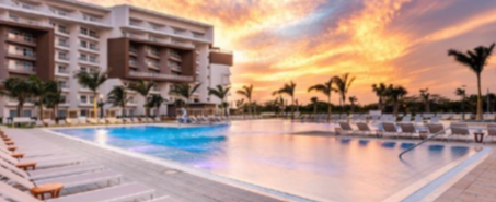Wellness activities like poolside yoga at Embassy Suites Aruba for women’s retreat