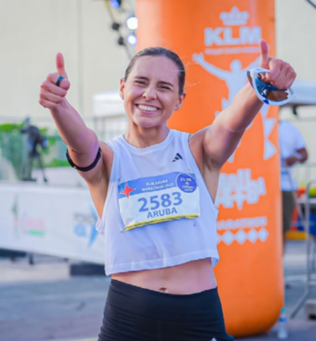 International runners pass Eagle Beach during KLM Aruba Marathon 2025