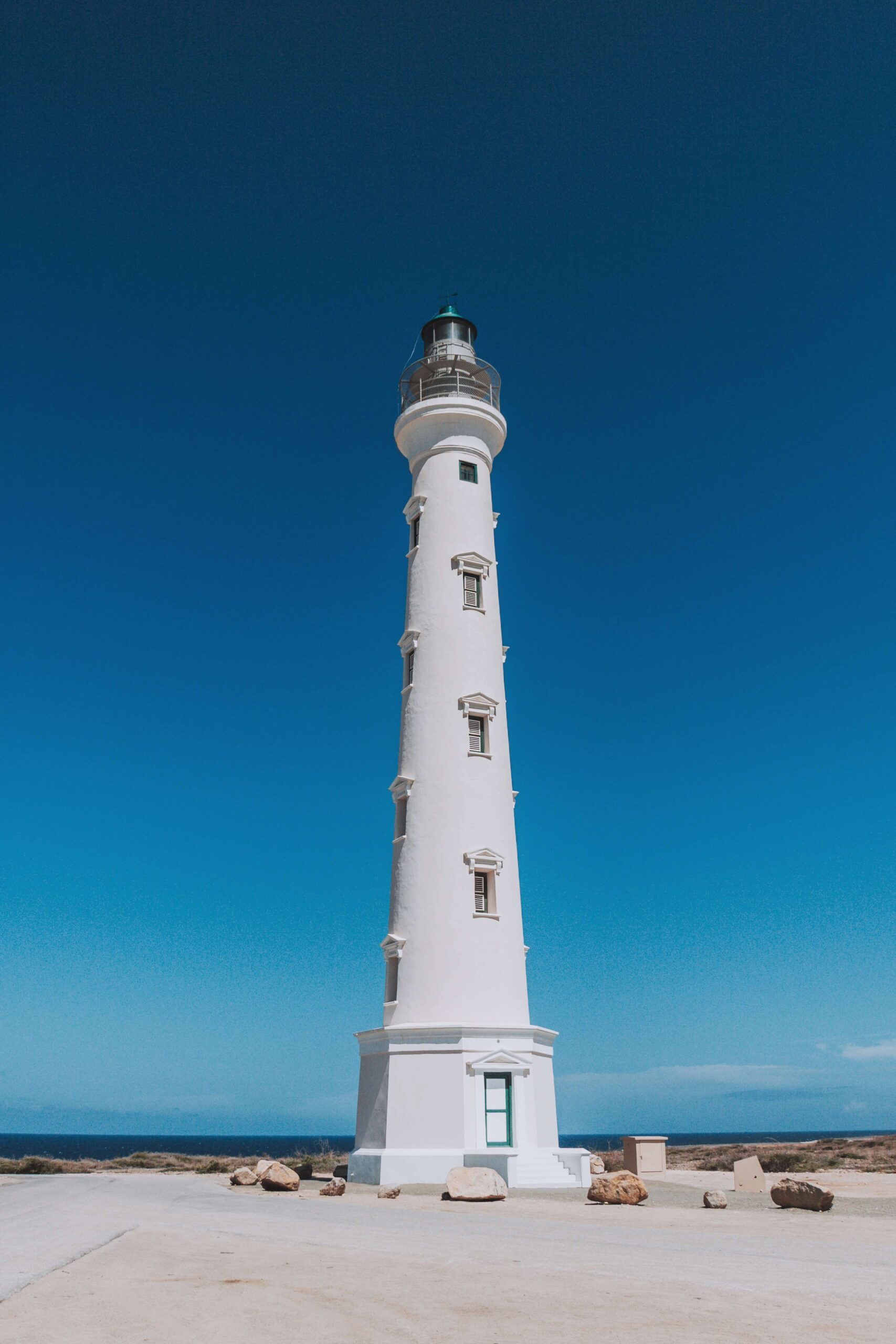 Workers restoring California Lighthouse exterior in Aruba