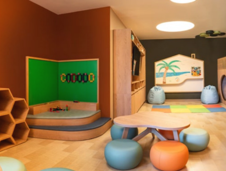 Interior view of a family suite with kitchenette at Embassy Suites Aruba Resort