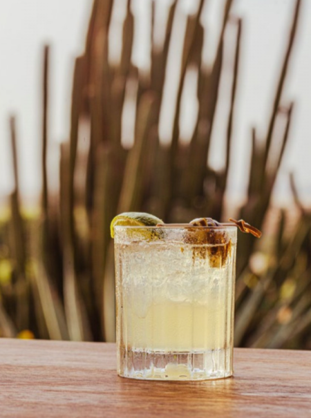 Scenic dining terrace at The Birdie with sunset views during Autentico Restaurant Week