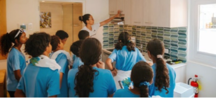Students and resort staff participate in beach cleanup in Aruba