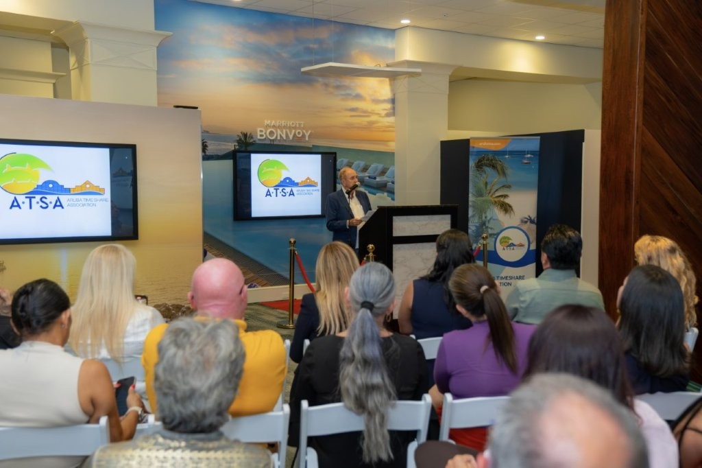 Speaker addresses guests during the Aruba Timeshare Evolution Documentary presentation at Marriott Ocean Club