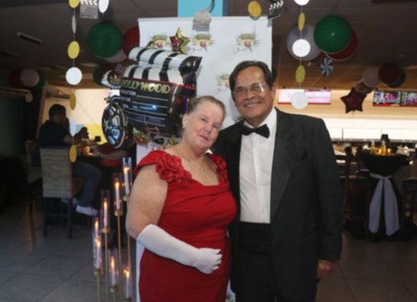 Employees celebrating 65 years of De Palm Tours in Aruba