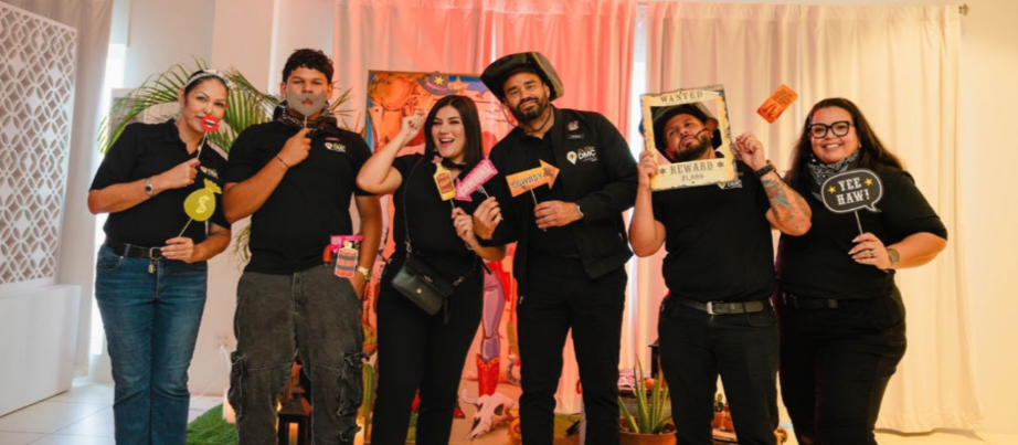 Team members celebrating anniversaries and recognition awards at De Palm Tours