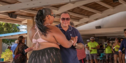 Employees and families enjoying activities during Family Day