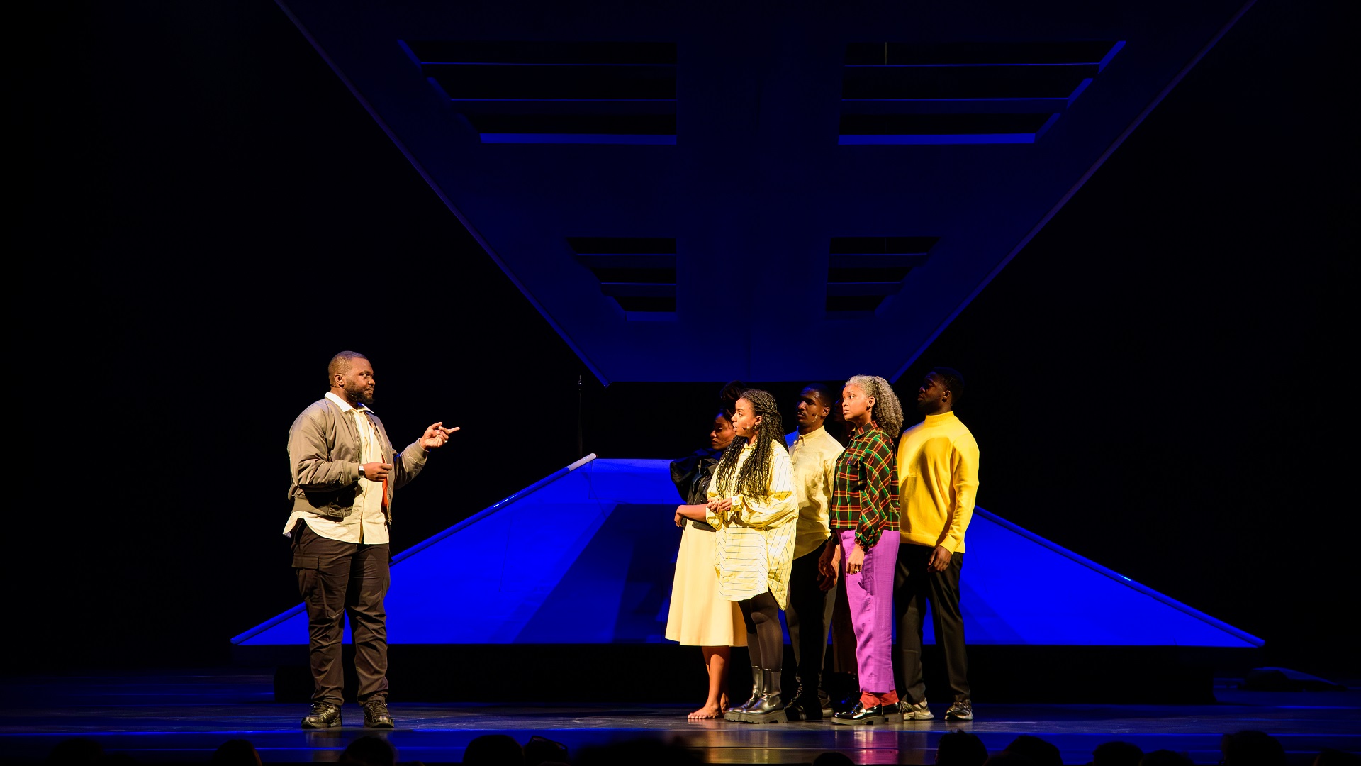 Cast performing emotional group scene in KINGS Come Home Aruba theater production