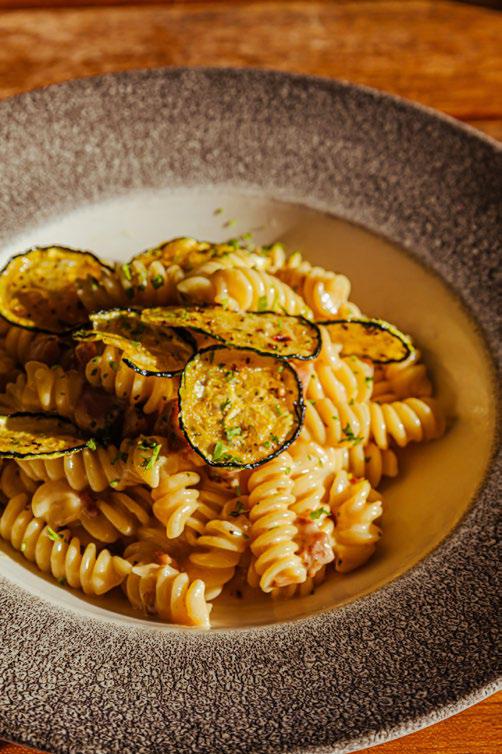 Fusilli zucchini pasta with white sauce and truffle oil at Mercat Aruba Marriott