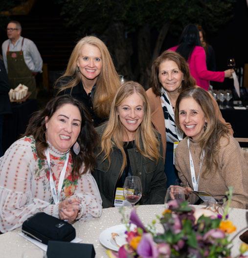 Attendees networking at Aruba luxury wellness meetings conference dinner