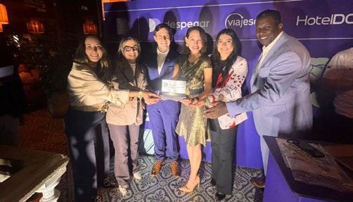 Aruba Tourism Authority team receiving award for highest sales growth in Latin America at industry event