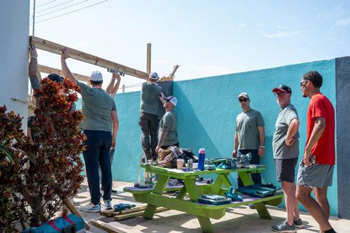 Volunteers building playground during Aruba CSR tourism initiative
