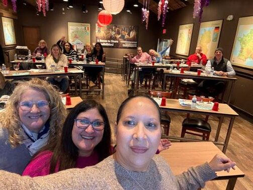 Travel advisors participating in Aruba tourism event with group networking and experience session